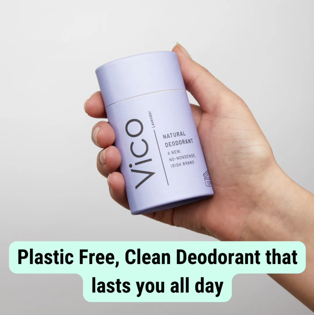 Hand holding a VICO deodorant stick with text about plastic-free and clean product.