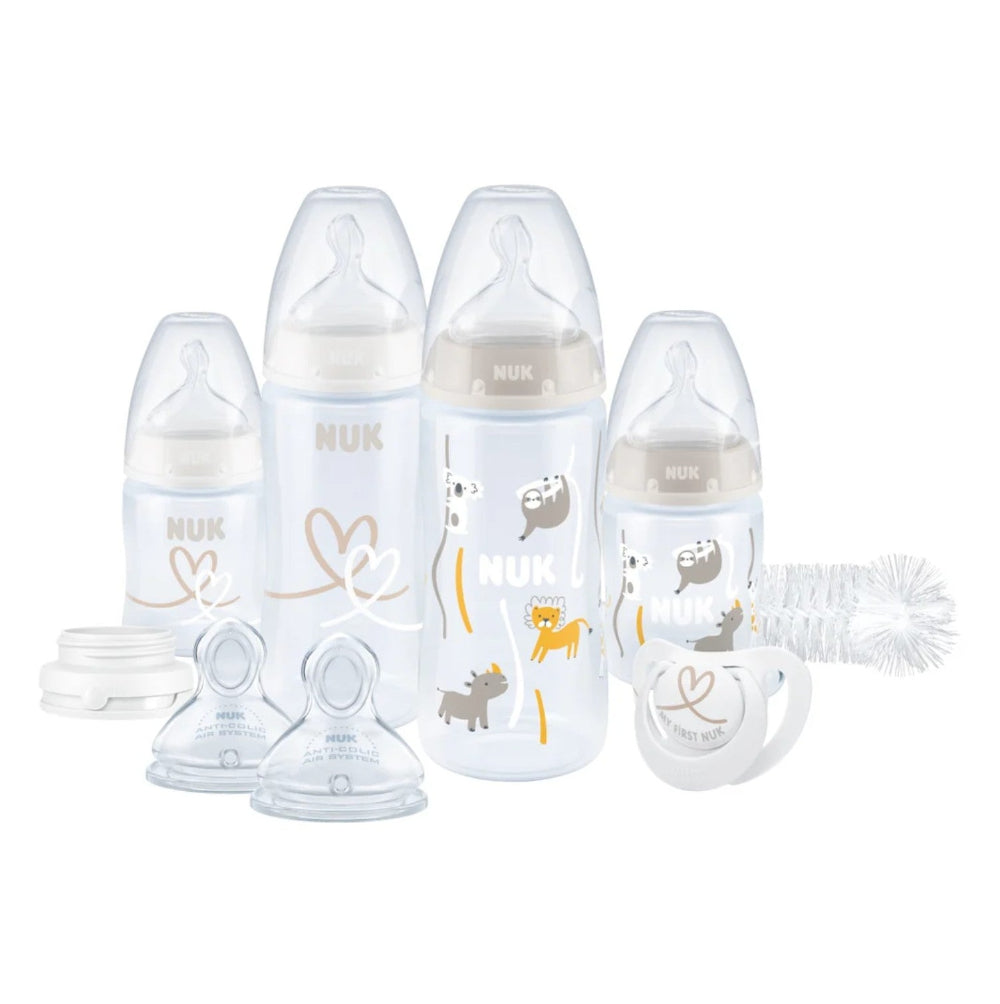 NUK baby bottle set with various components on a white background