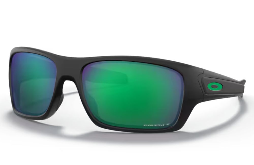 Sunglasses with green lenses and black frame on a white background