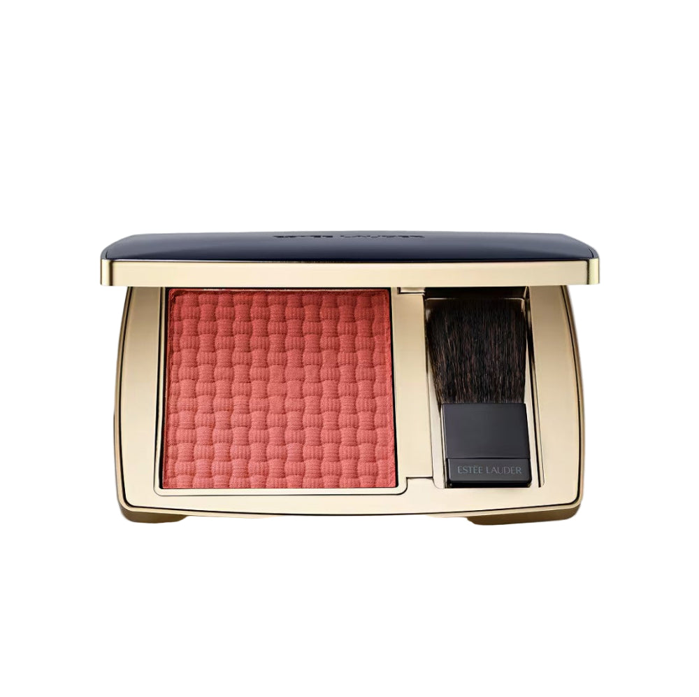 Makeup compact with pink blush and black brush on a white background