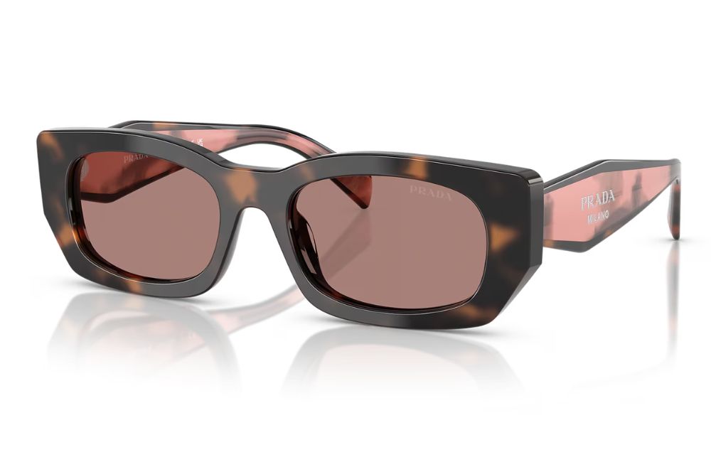 Sunglasses with tortoiseshell frame and brown lenses on a white background