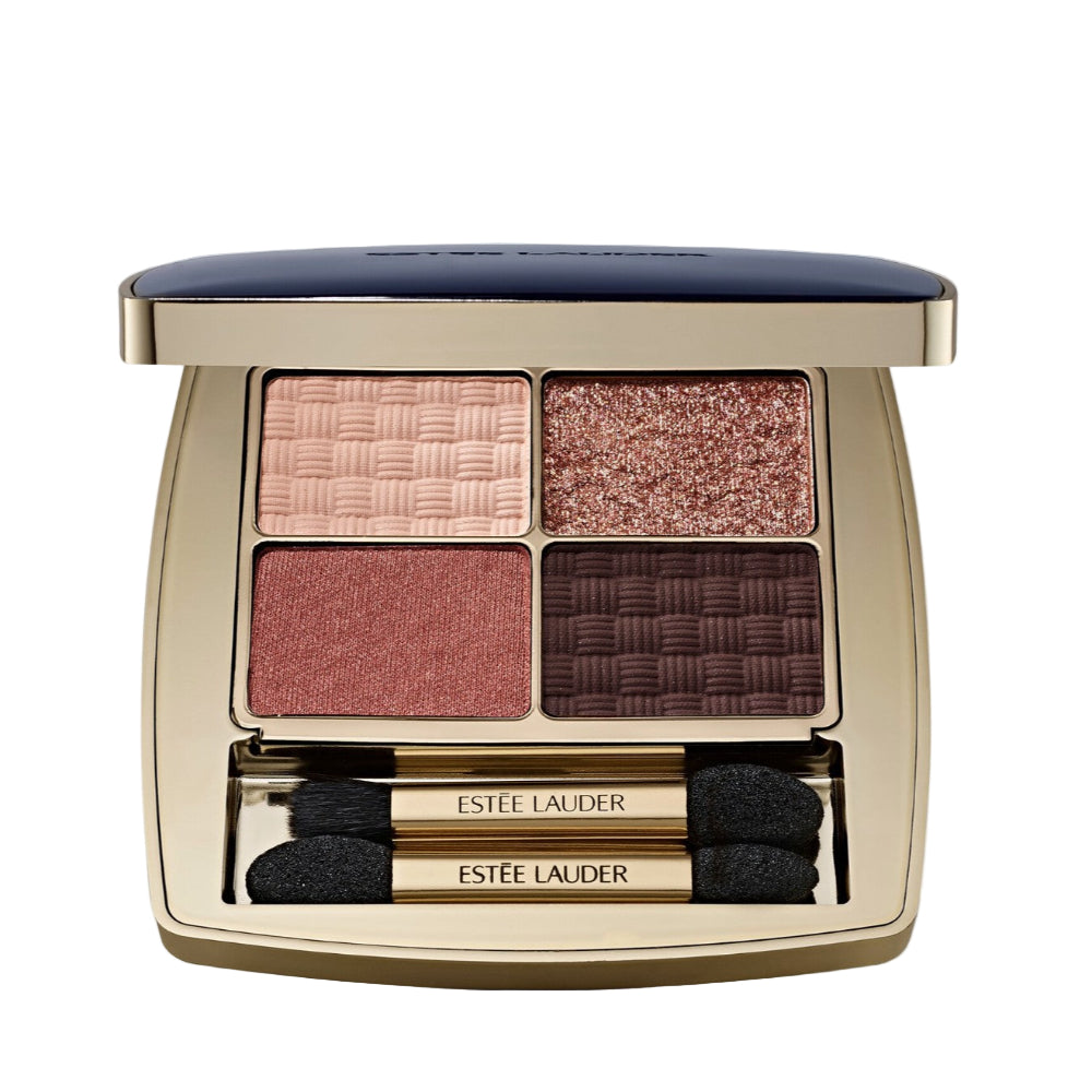Estee Lauder eyeshadow palette with four shades and two applicators on a light gray background