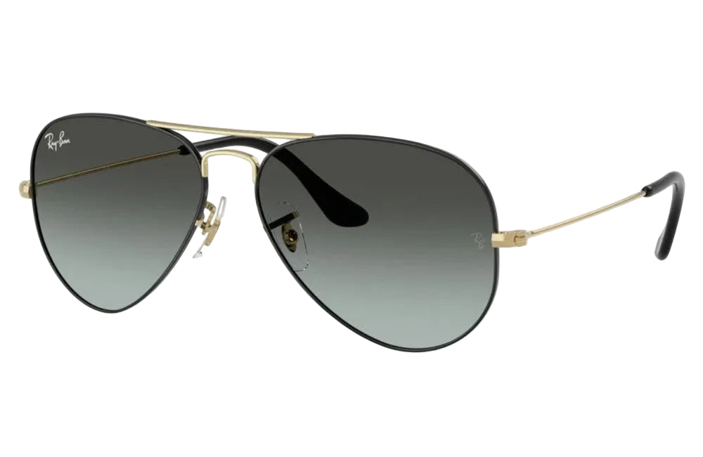 Aviator sunglasses with gold frame and dark lenses on a white background