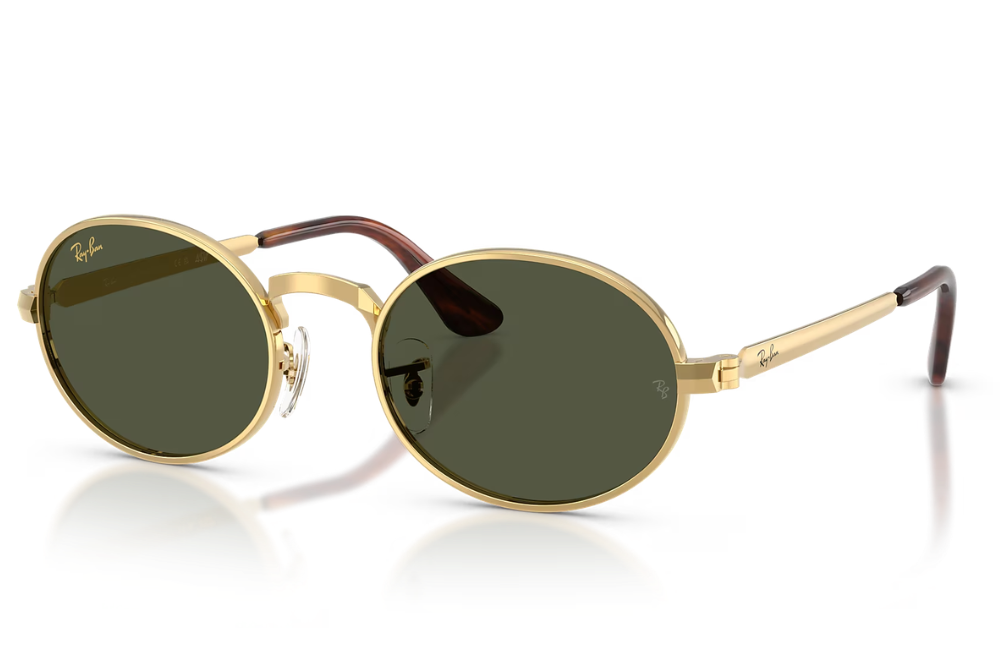 Gold-framed sunglasses with green lenses on a white background