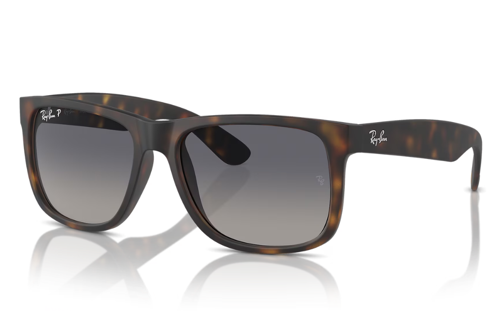Ray-Ban sunglasses with tortoiseshell frame and dark lenses on a white background