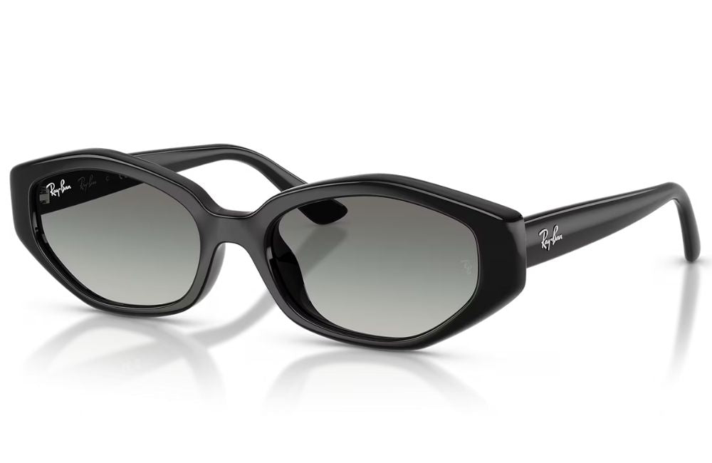 Ray-Ban cat-eye sunglasses with a glossy black frame and gradient grey lenses