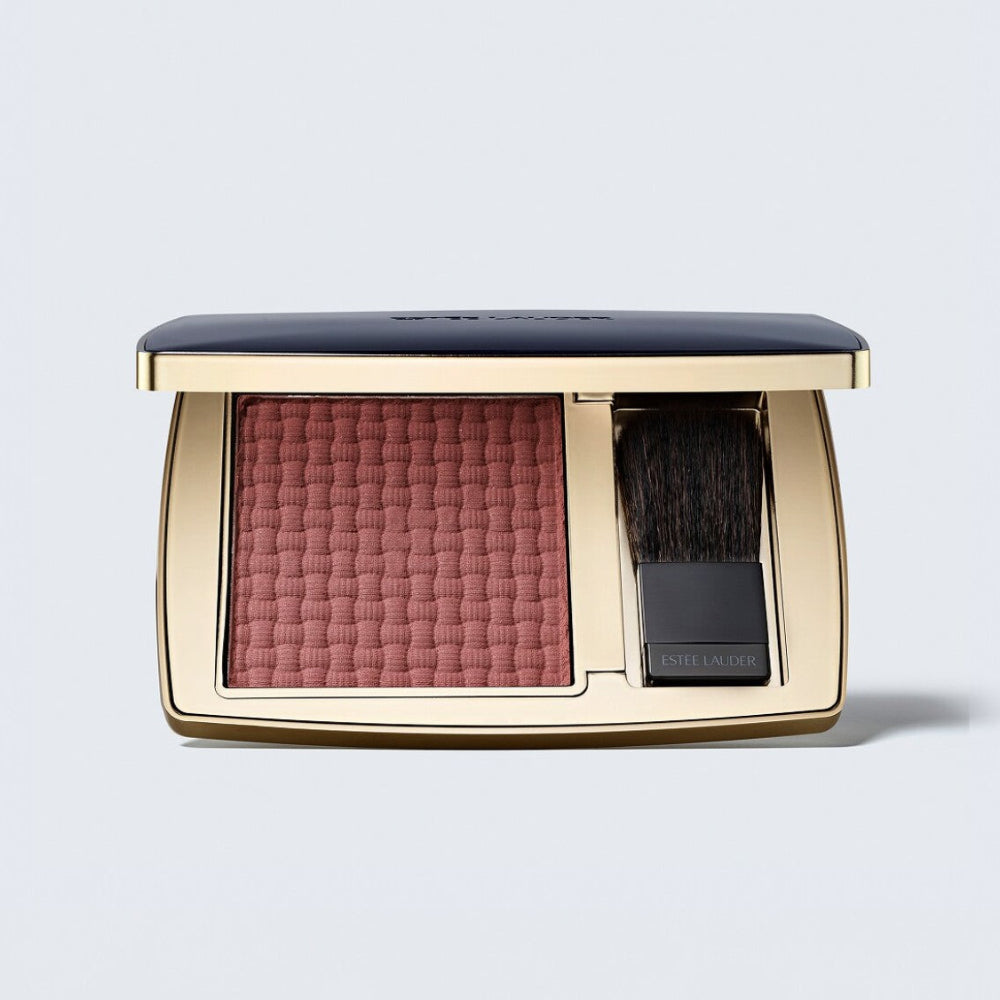 Makeup compact with blush color on a light gray background