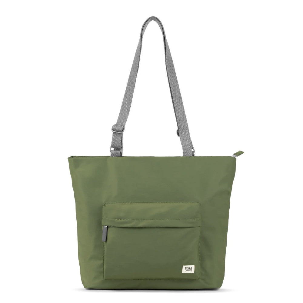 Green tote bag with a pocket on a white background