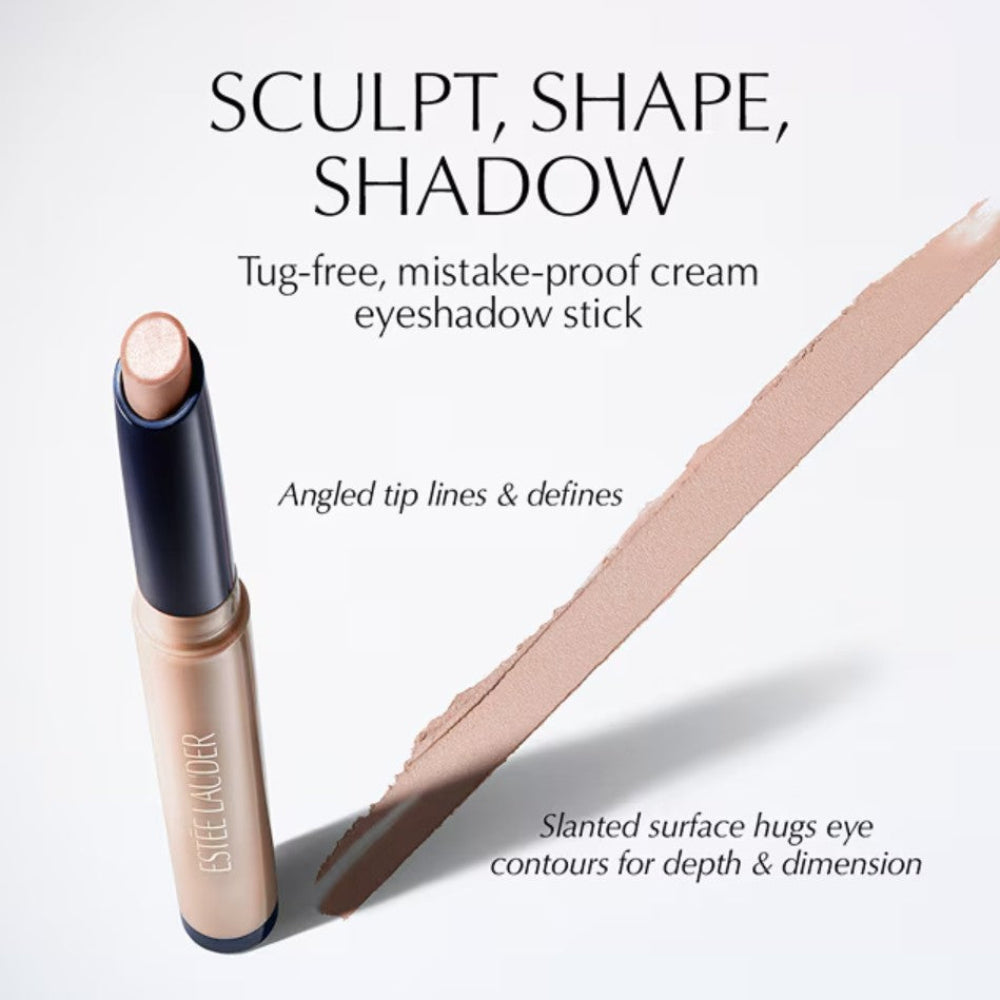 Estée Lauder cream eyeshadow stick shown with large text reading 'SCULPT, SHAPE, SHADOW' and a beige makeup swatch on a clean white background.