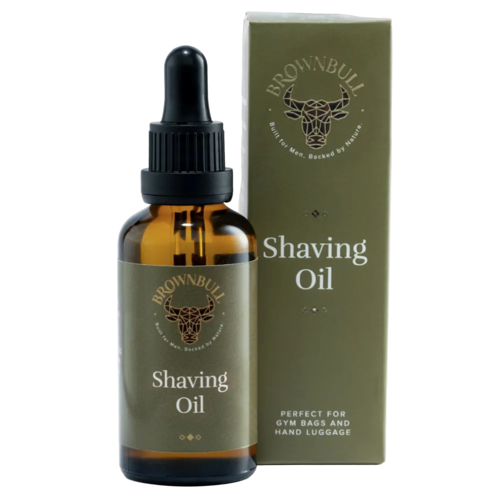 Brownbull Shaving Oil in an amber glass dropper bottle next to its olive green packaging box, on a solid white background.