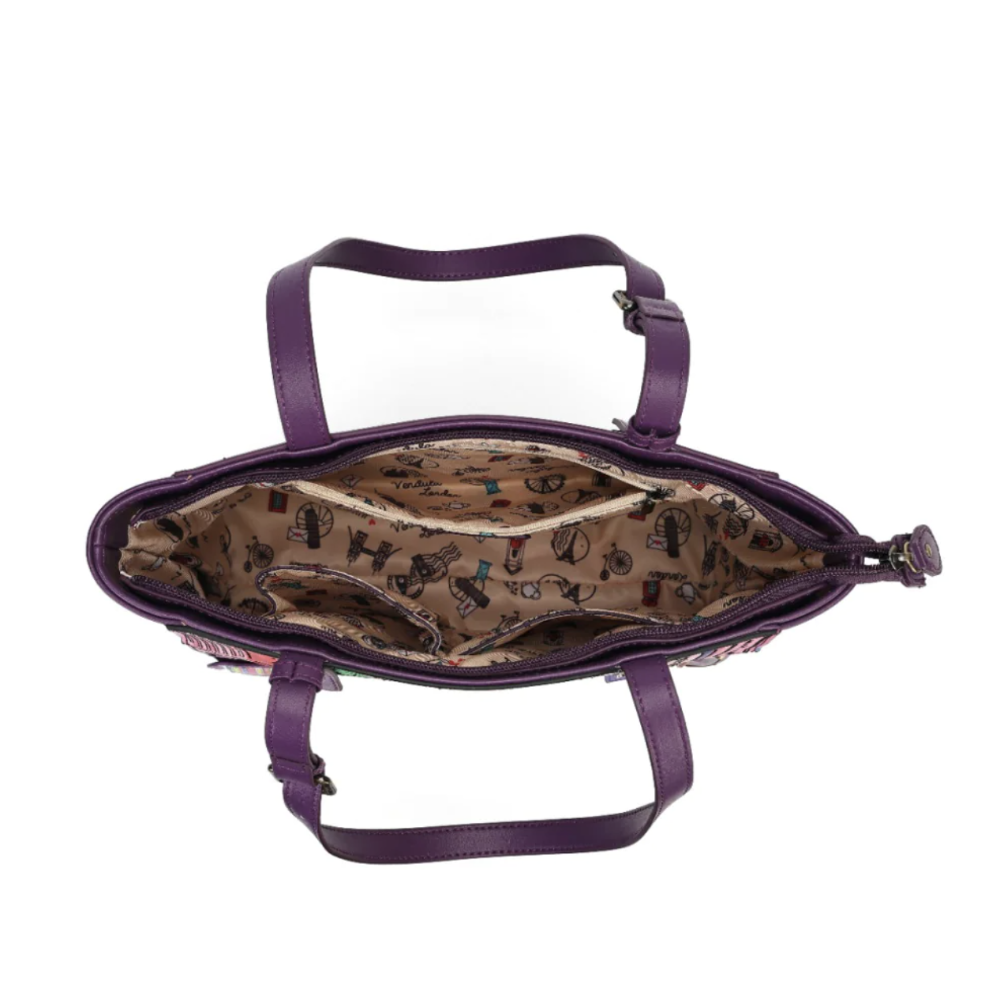 An open purple handbag shown from above, revealing a patterned beige interior lining with small fashion illustrations and a matching purple shoulder strap.