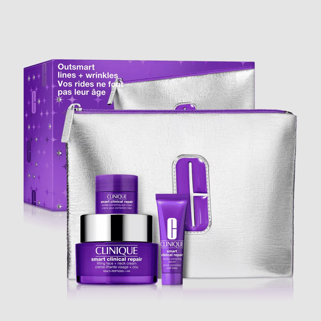 Clinique skincare set with purple and silver bag on a white background