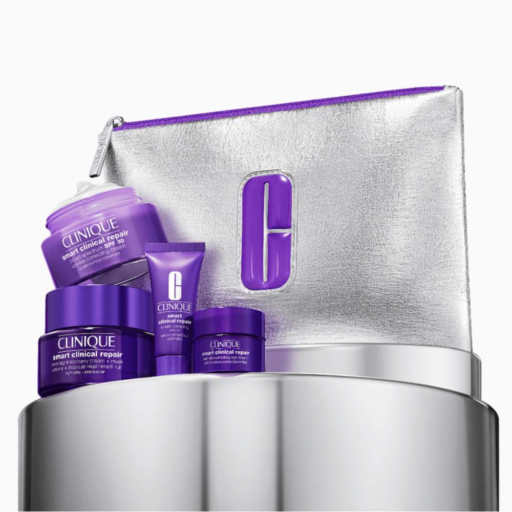 Clinique skincare products with a silver pouch on a white background