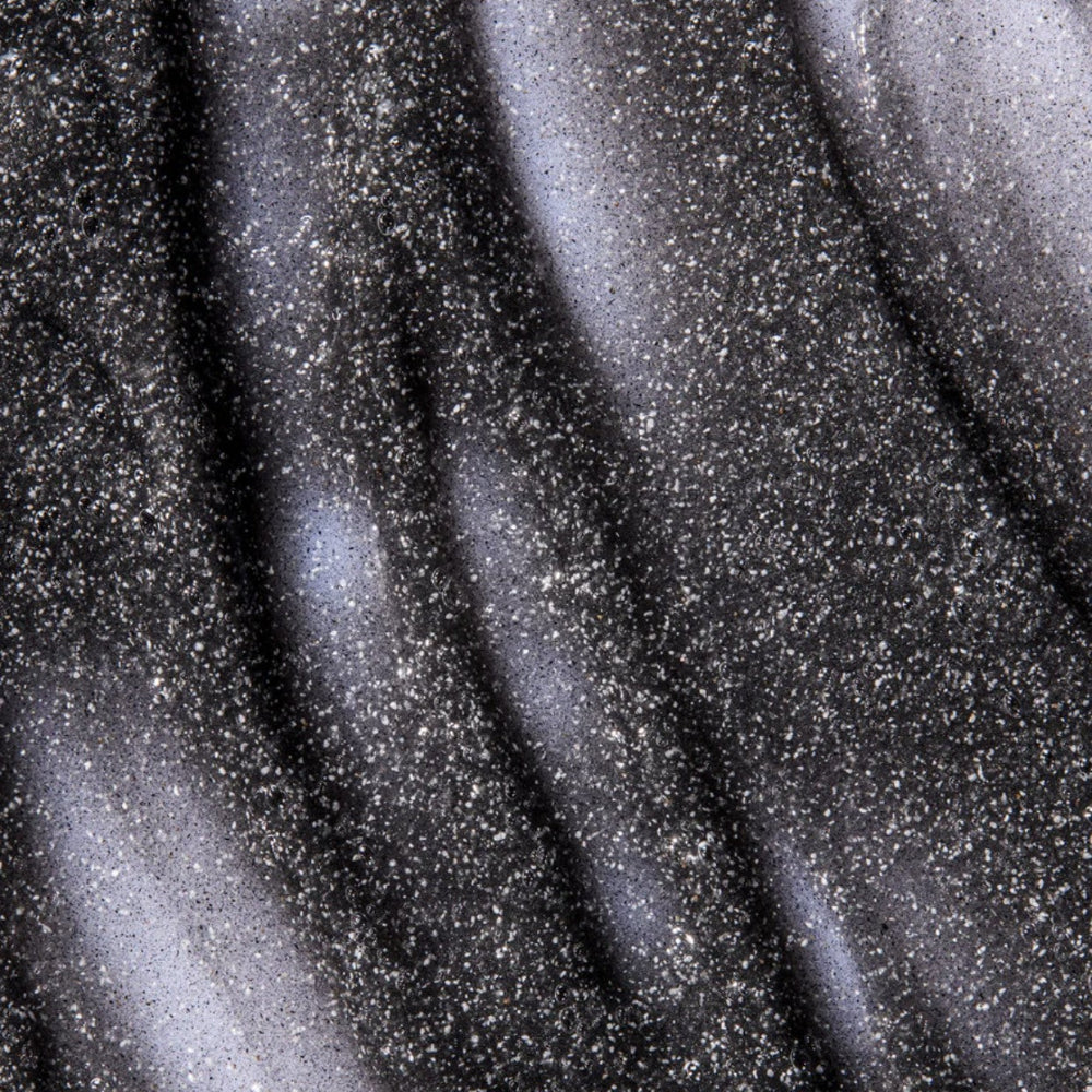 Close-up of a textured black surface with speckles