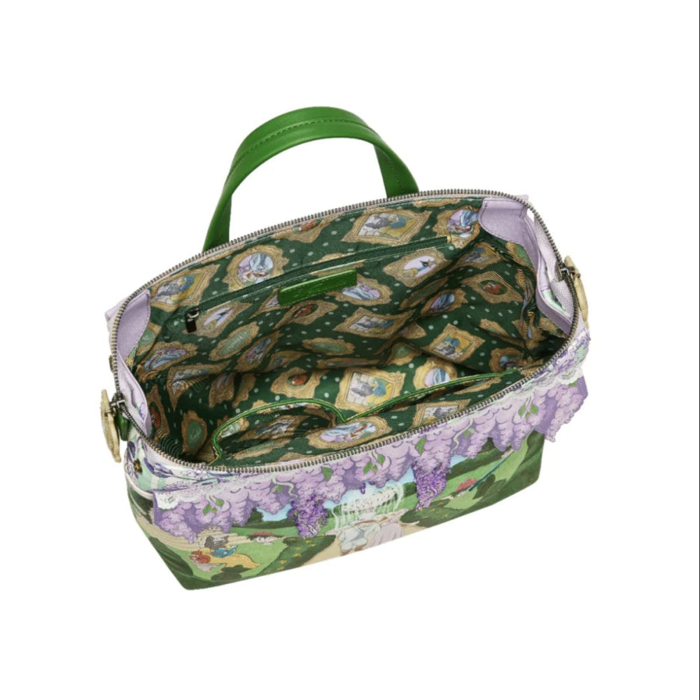 Green patterned bag with floral accents on a white background
