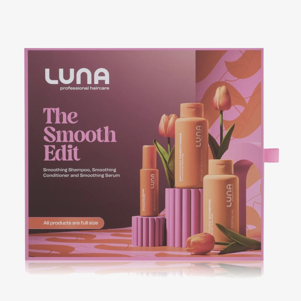 LUNA The Smooth Edit haircare set in its retail box, featuring three full-size bottles and a tube of smoothing products against a pink and orange floral background.