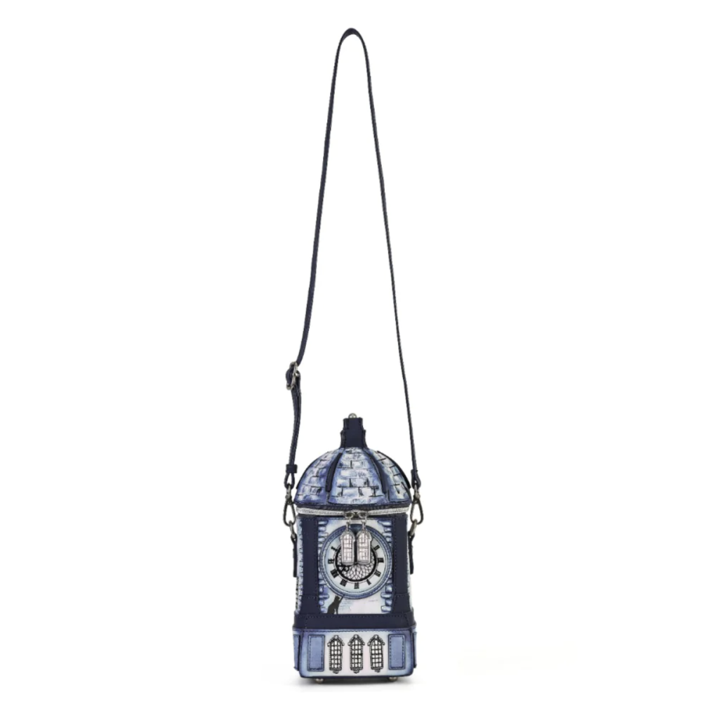 A miniature blue and white patterned clock-shaped shoulder bag with a long black strap, shown against a plain white background.
