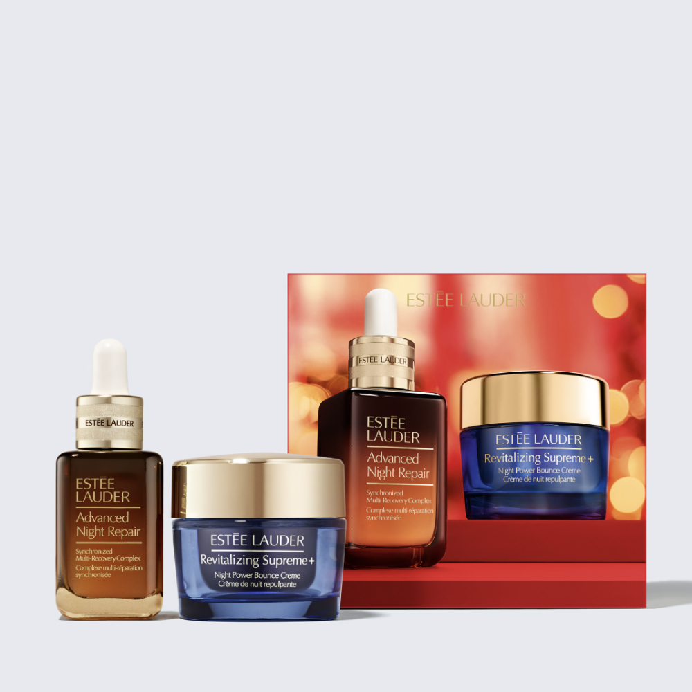 Estée Lauder skincare gift set featuring Advanced Night Repair serum, Revitalizing Supreme+ cream, and a matching red gift box