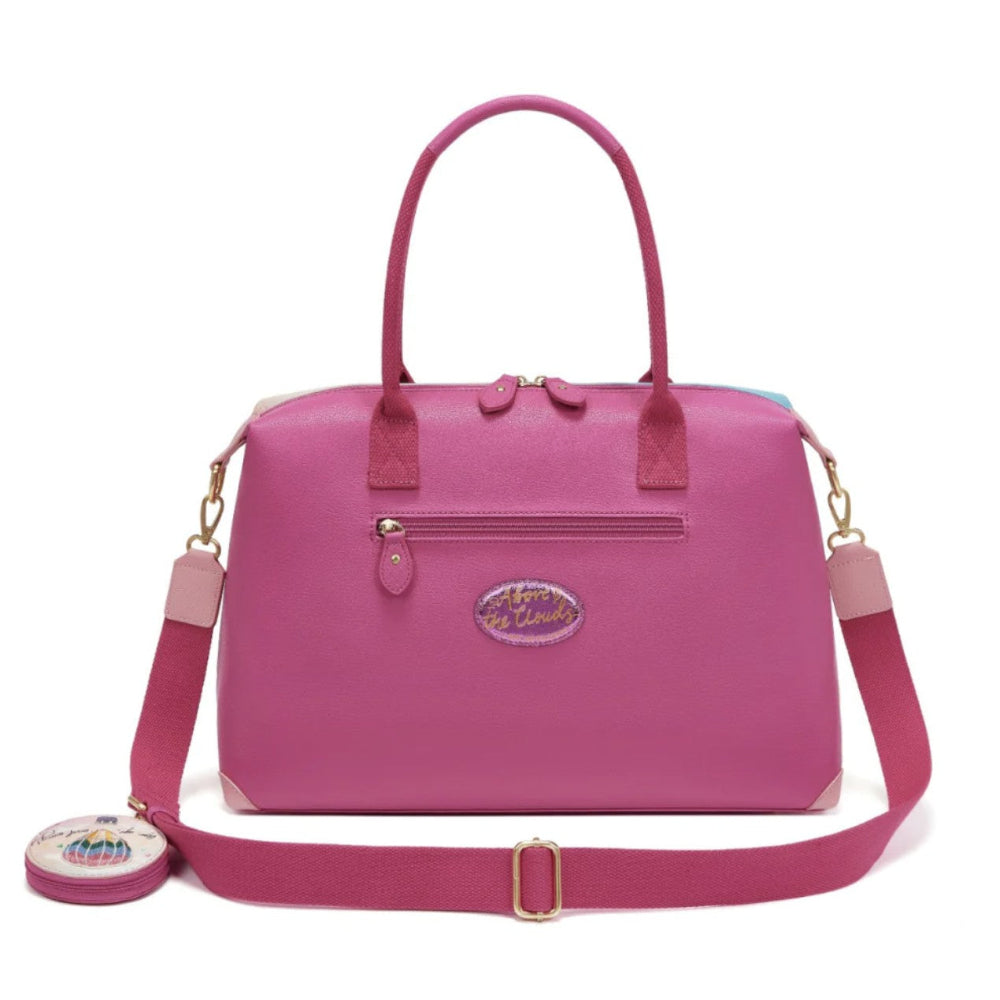 Pink handbag with a strap on a white background