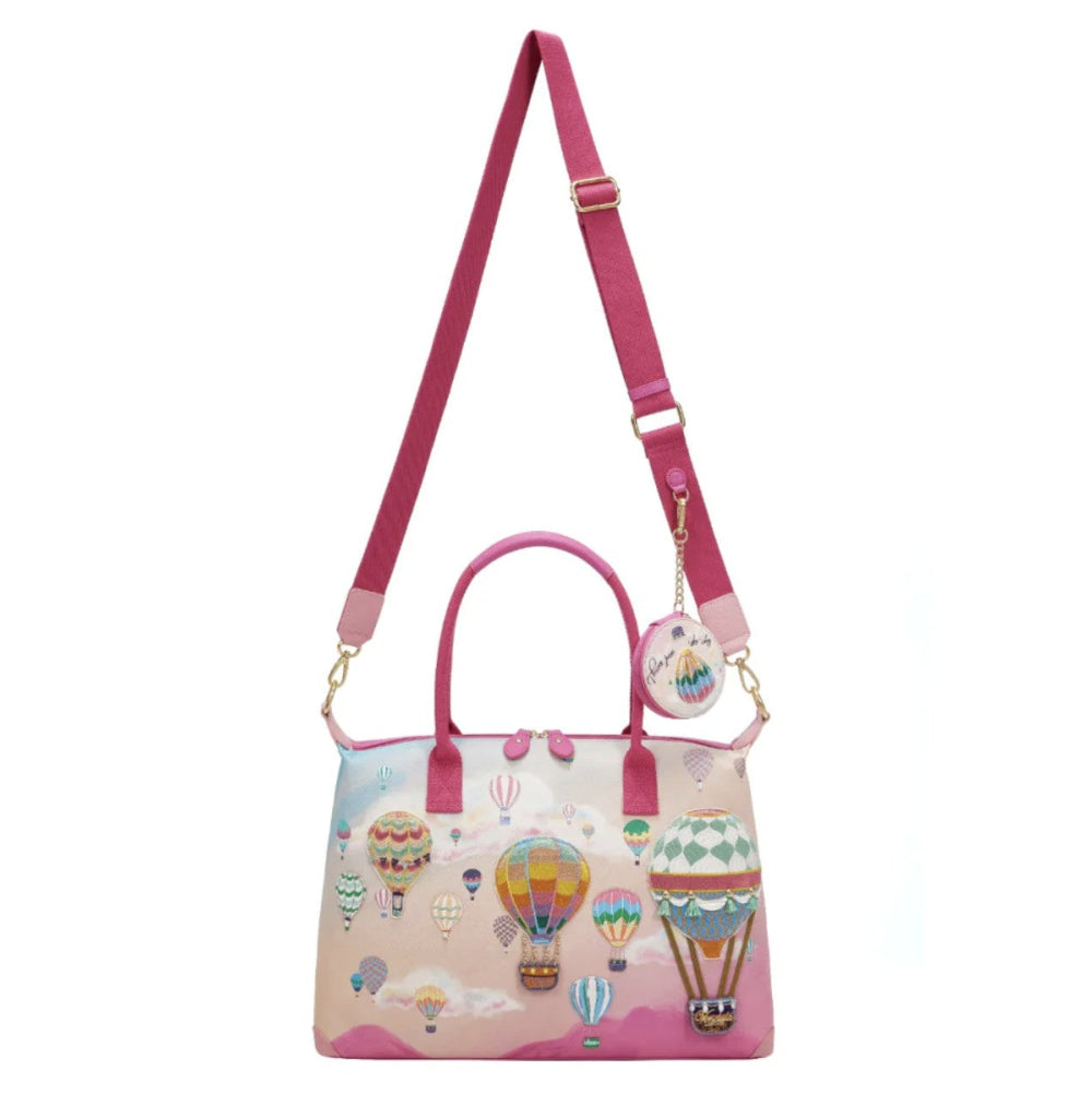 Handbag with hot air balloon design and pink strap on a white background