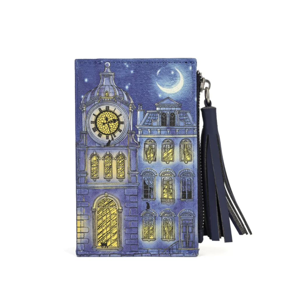 A zip wallet with a navy blue leather tassel strap, featuring a detailed illustration of a clock tower building under a starry night sky with a crescent moon.