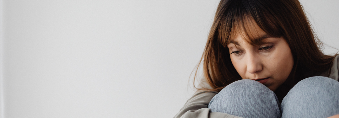 Woman experiencing depression sad expression on face