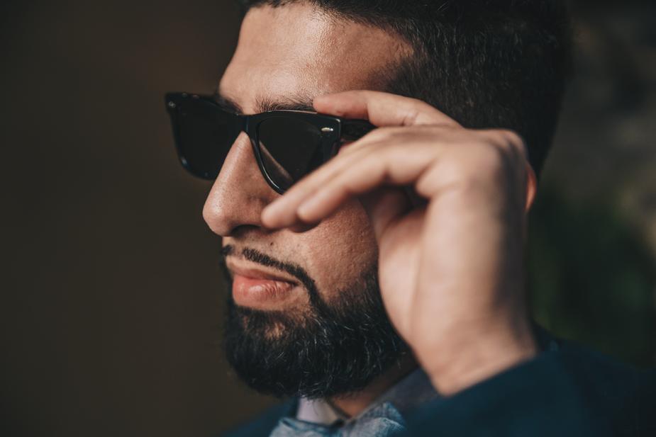 Man wearing polarized sunglasses to protect his eyes