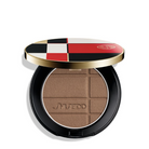 Shiseido Pressed Powder Compact in a round black case with a gold rim and a checkered lid featuring red, black, white, and gold. The compact is open, showing a pressed bronze powder with a grid texture and the Shiseido logo embossed in the center.