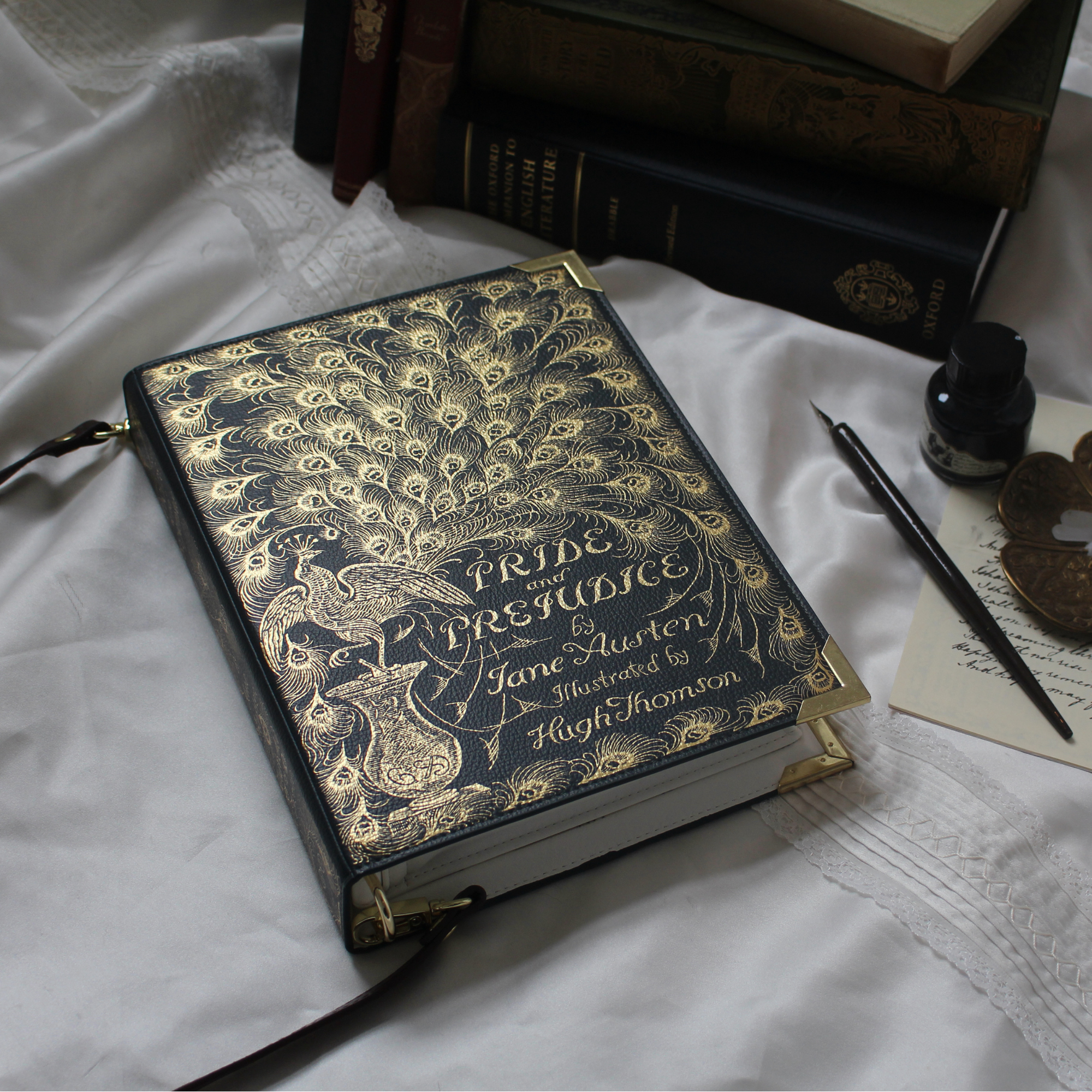 Book-shaped handbag with 'Pride and Prejudice' design on a white background