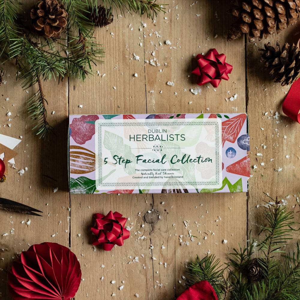 Herbalists 45 Step Facial Collection box on a wooden surface with Christmas decorations.