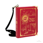 A red faux-leather crossbody bag designed to look like a vintage 'Beauty & the Beast' book, shown on a white background.