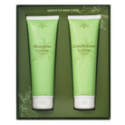 Two green tubes labeled 'Shampoo Crème' and 'Conditioner Crème' in a box with 'Earth to Skin Care' branding.