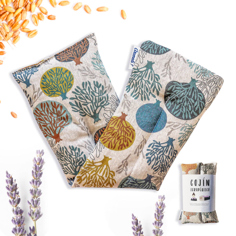 A pair of therapeutic pillows with a printed design featuring purple flowers and lavender, along with individual packaging shown in the foreground.