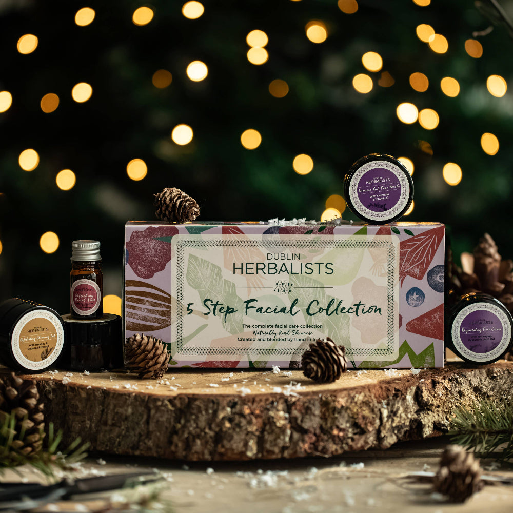 Herbalists 5 Step Facial Collection on a wooden platform with Christmas lights in the background