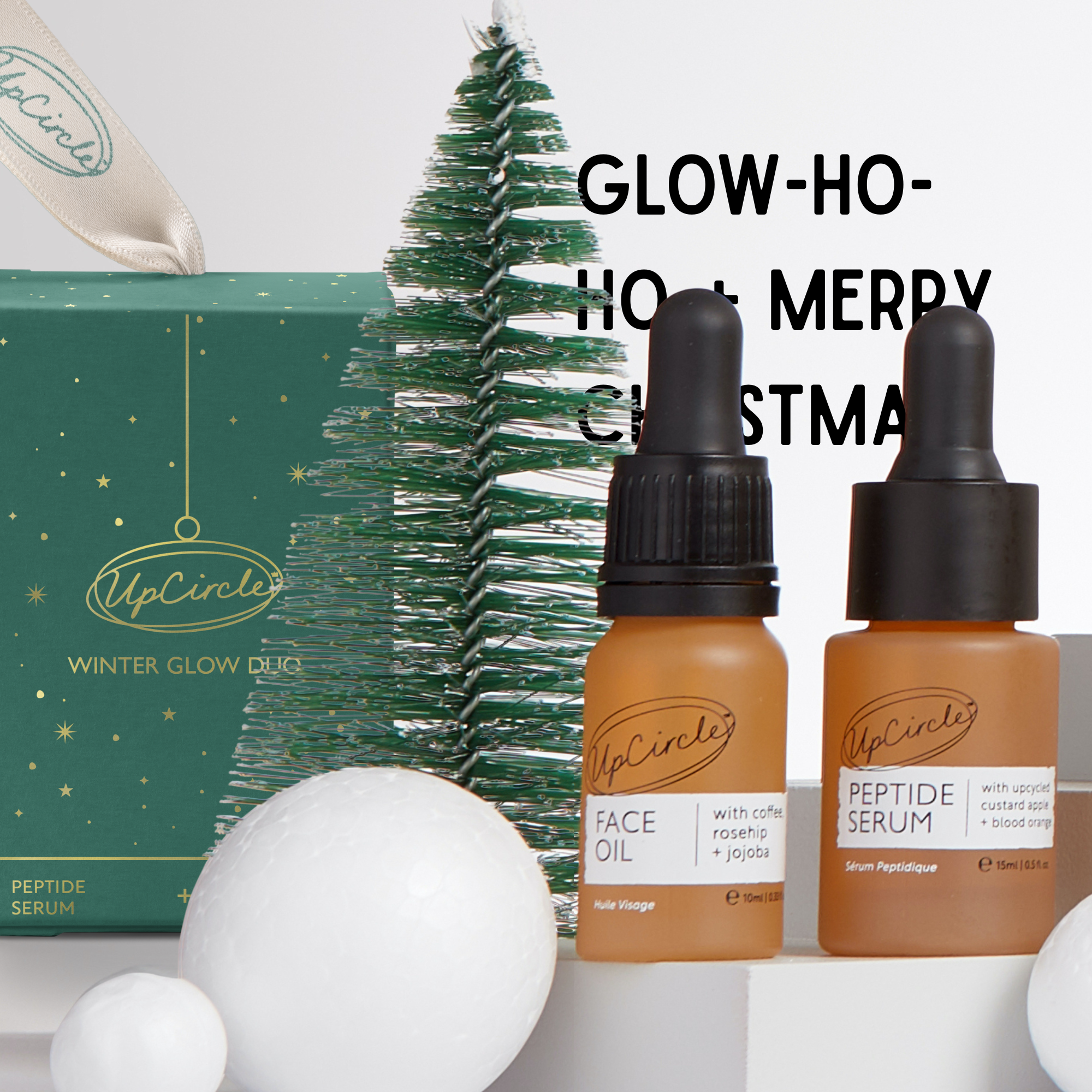 UpCircle skincare products with a Christmas tree and gift box in the background