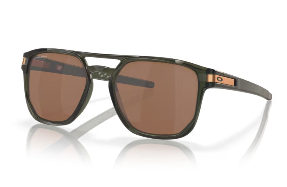 Oakley sunglasses with a translucent olive green frame and bronze polarized lenses