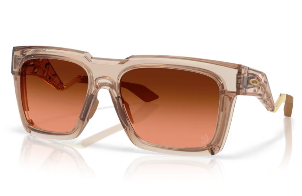 Sunglasses with brown gradient lenses and clear frame on a white background