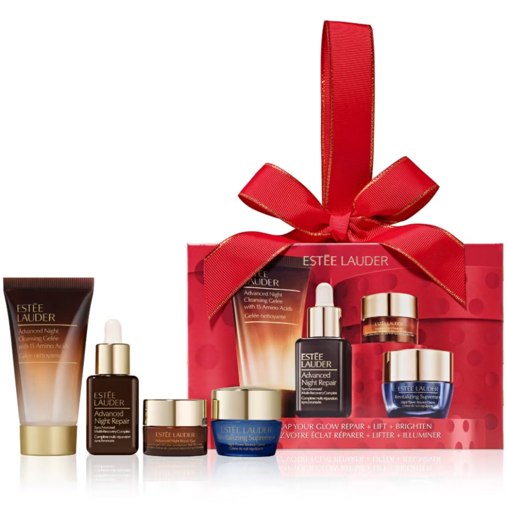 Estée Lauder skincare set with red ribbon packaging on a white background