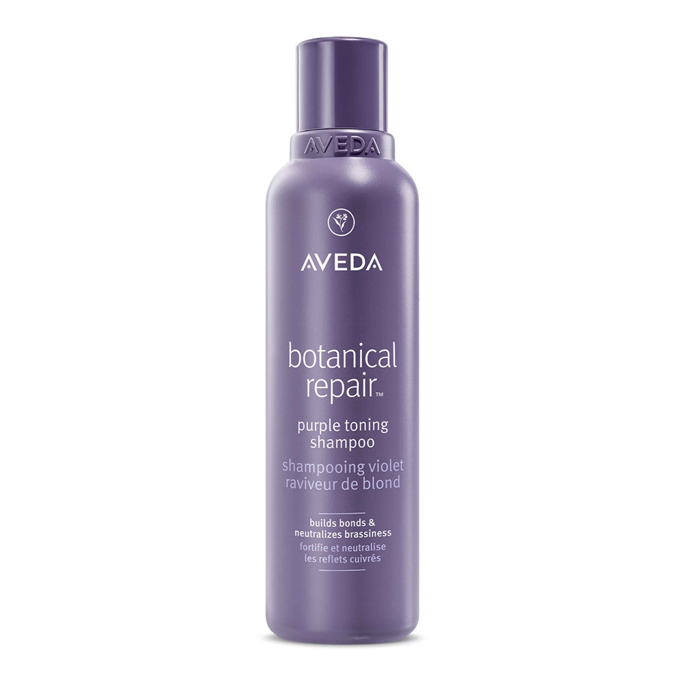 Aveda botanical repair purple shampoo bottle on a white background