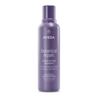 Aveda botanical repair purple shampoo bottle on a white background