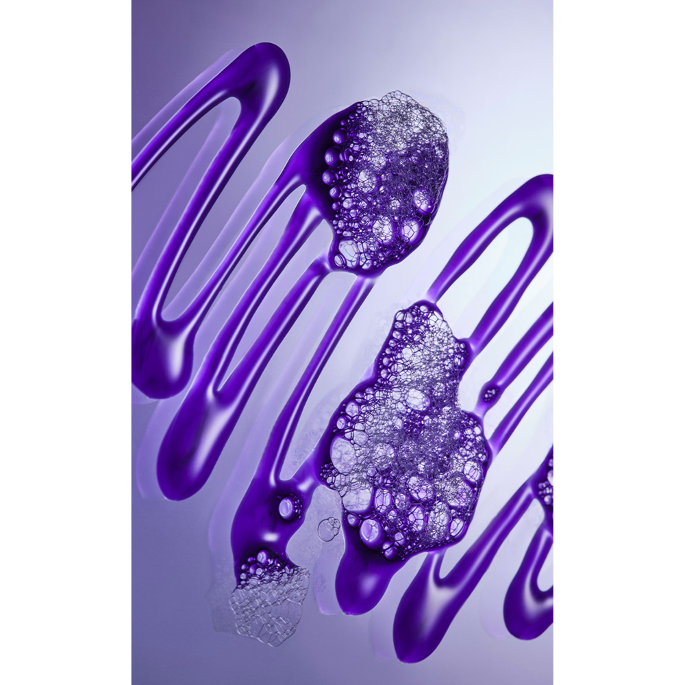 Purple liquid with bubbles on a light purple background