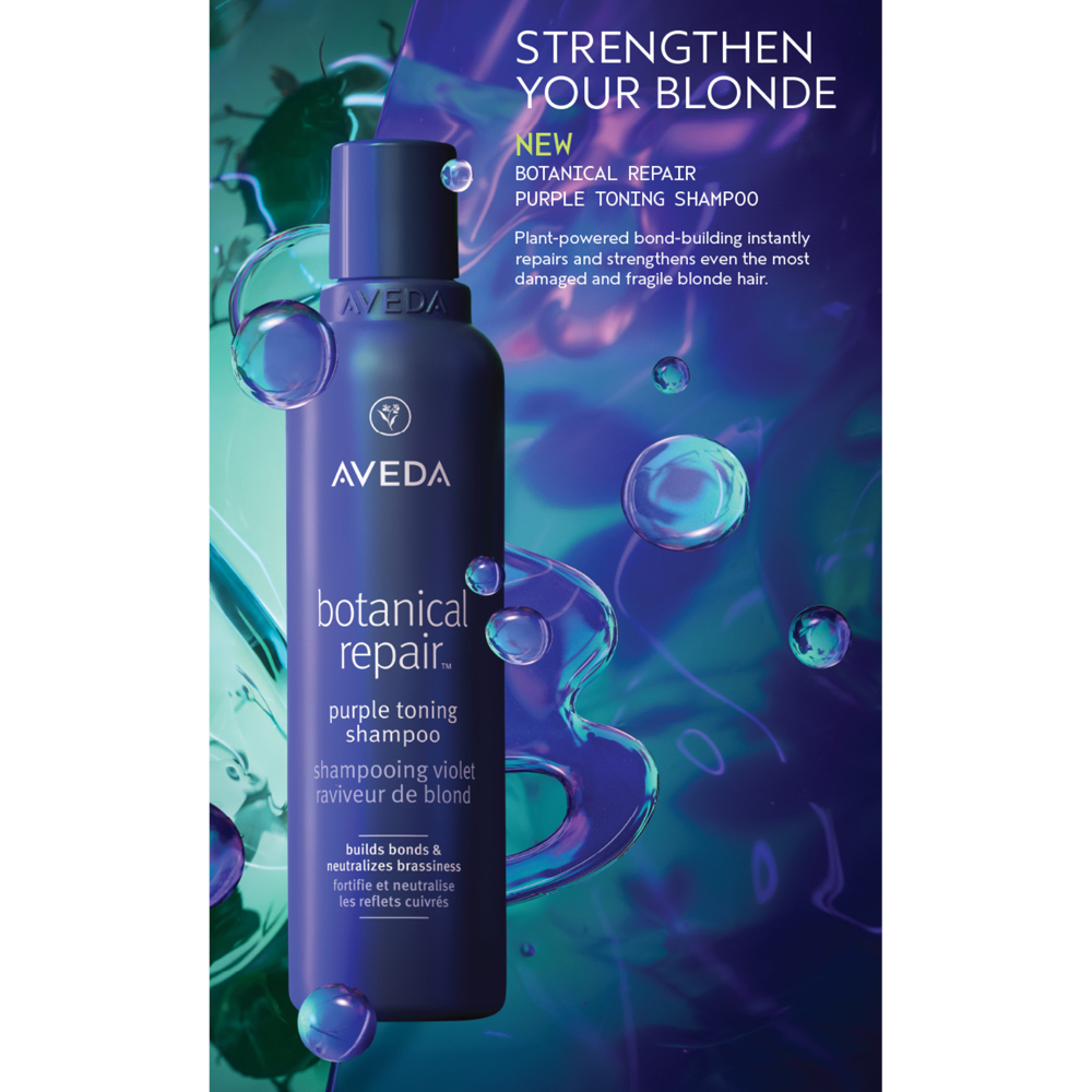 Aveda botanical repair purple toning shampoo bottle with packaging on a blue and green abstract background