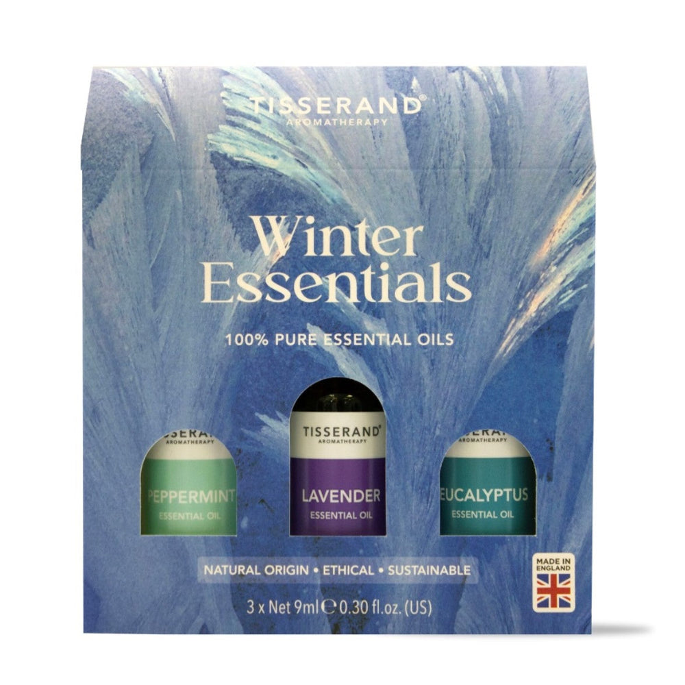 Tisserand Winter Essentials essential oils set packaging with three bottles on a blue background
