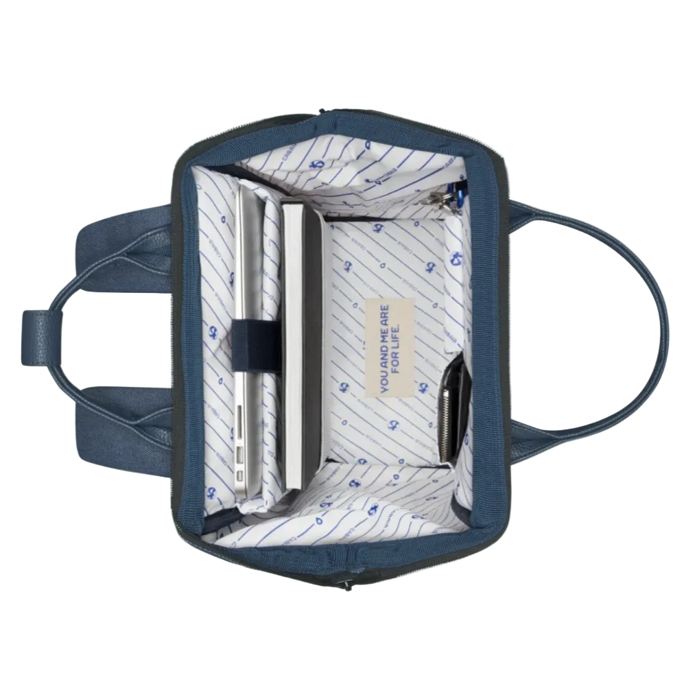 Blue bag with a patterned interior on a white background