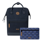 A navy blue Cabaan backpack with tan leather accents shown next to a matching patterned blue and white zip pouch on a light off-white background.