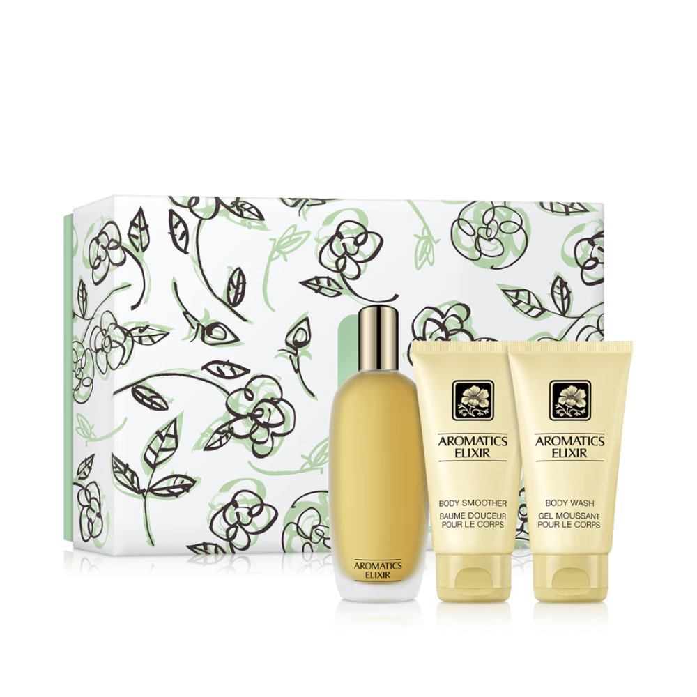Cosmetic set with 'Aromatics Elixir' products including a bottle and two tubes in front of a floral-patterned box.