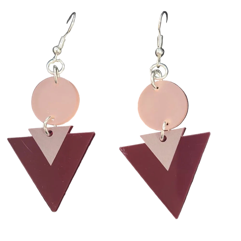 Geometric earrings on a card with a white background