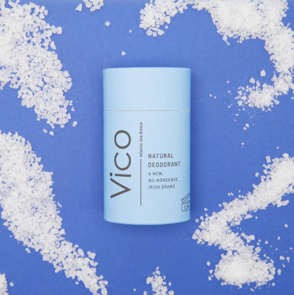 Vico natural deodorant stick on a blue background with salt crystals