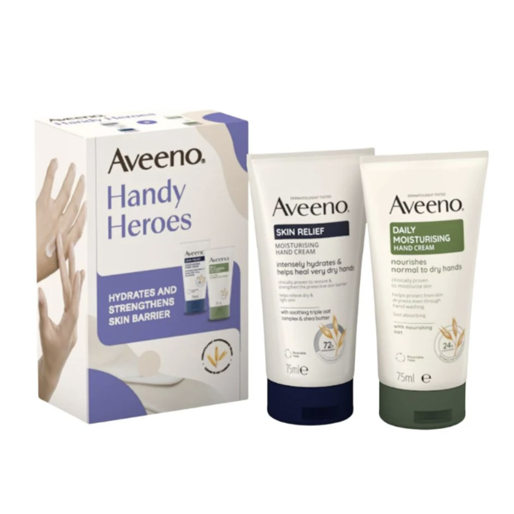 Aveeno Handy Heroes skincare set featuring a white and purple retail box alongside two tubes: Skin Relief Hand Cream with a dark navy cap and Daily Moisturising Hand Cream with a dark green cap, shown on a white background.