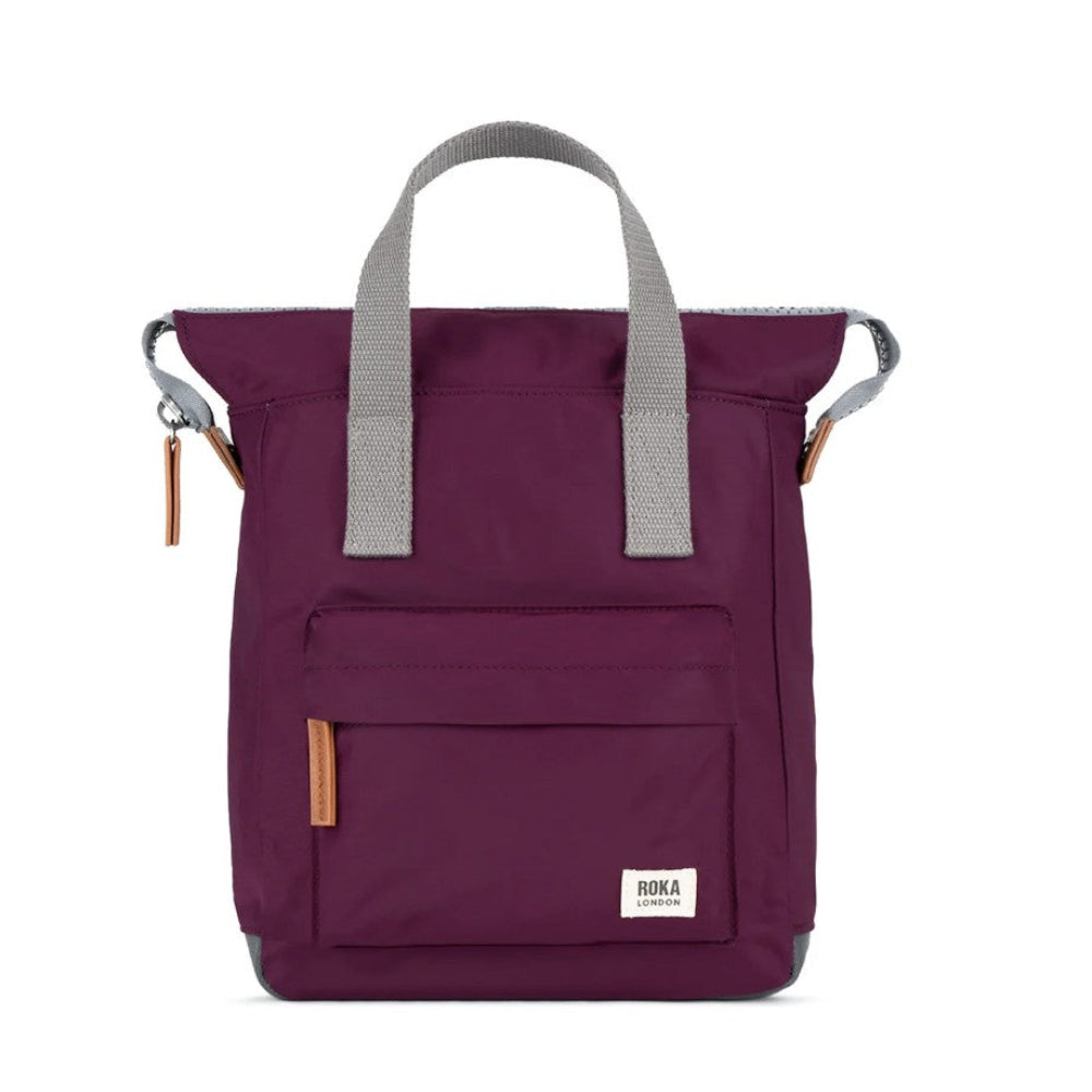 A burgundy tote bag with grey handles.